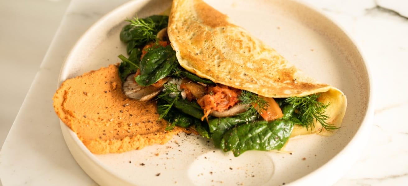 picture of plated omlette and hummus spread